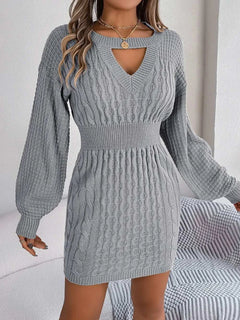 Gray cable-knit cutout round neck slit sweater dress with long sleeves and fitted waist.