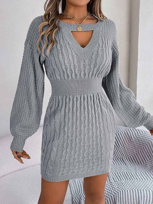 Gray cable-knit cutout round neck slit sweater dress with long sleeves and fitted waist.