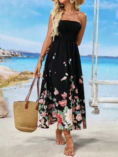 Printed tube midi dress with floral pattern worn on the beach.