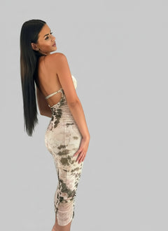 Backless printed halter neck dress in mirror selfie.