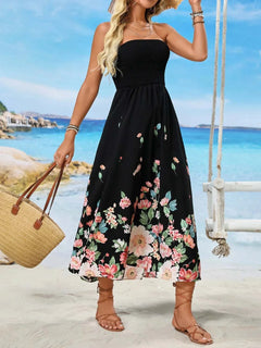 Printed Tube Midi Dress with floral design on a beach background.