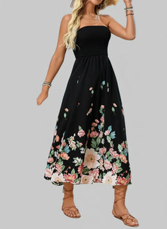 Printed Tube Midi Dress with floral design on a beach background.