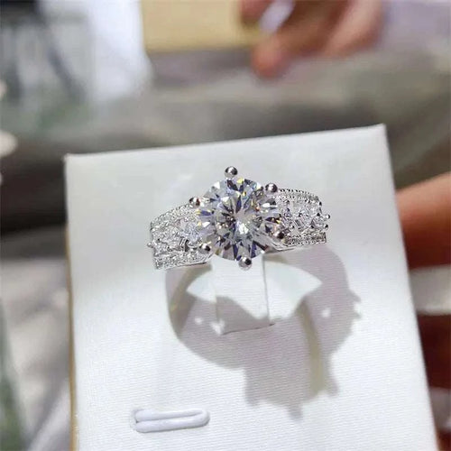 3 carat moissanite ring in 925 sterling silver with zircon accents and platinum plating in a jewelry box