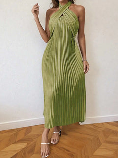 Green pleated halter neck midi dress with crossed straps and tied back detail