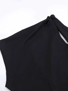 Black asymmetrical tied sleeveless maxi dress made of 100% polyester with no stretch and unlined body.