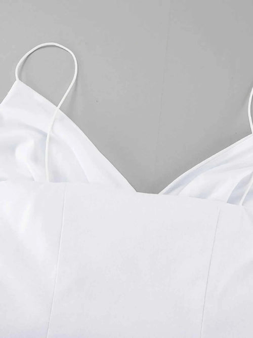 White ruffled V-neck maxi dress with thin straps and lined 100% cotton fabric.