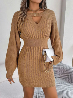 Brown cable-knit cutout round neck slit sweater dress with long sleeves and fitted waist.