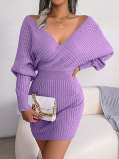Purple rib-knit dolman sleeve sweater dress with surplice neckline and A-line hem, casual mini length.