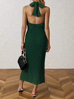 Green pleated halter neck midi dress with tied back detail and no stretch polyester fabric