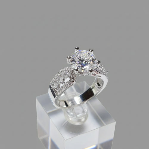 3 carat moissanite ring in 925 sterling silver with zircon accents and platinum plating displayed on white cushion
