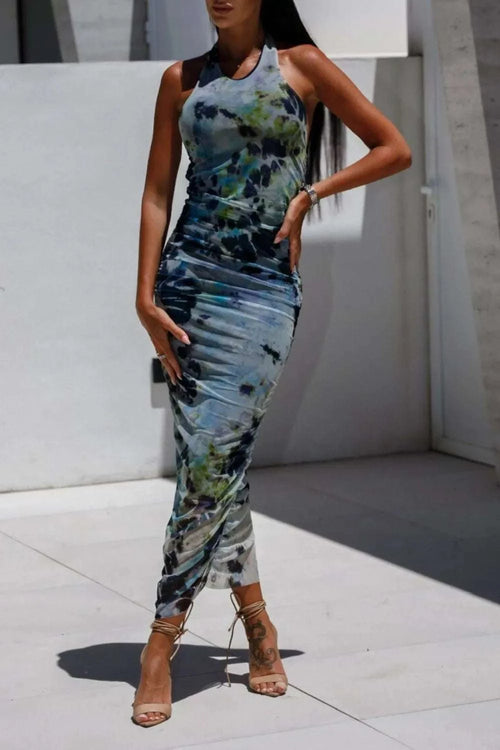 Backless printed halter neck dress with abstract design.