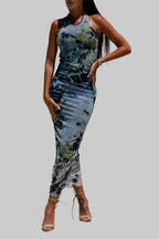 Backless printed halter neck dress with abstract design.