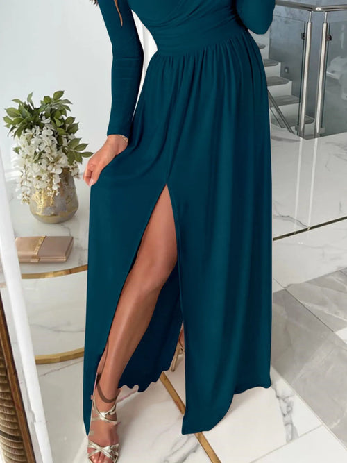 Plus size long sleeve maxi dress with slit and surplice cutout detail in dark teal color