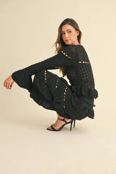 Long sleeve tiered ruffle knit midi dress in cable-knit fabric.