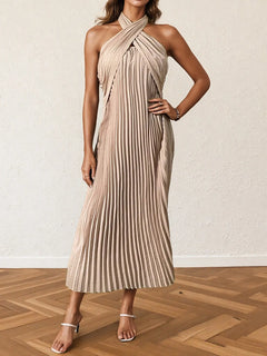 Beige pleated halter neck midi dress with a tied neckline and no stretch, made from 100% polyester.