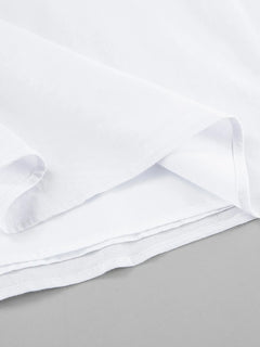 Close-up of white fabric lining detailing of a Ruffled V-Neck Maxi Dress made of 100% cotton with no stretch and frill features