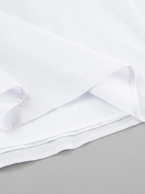 Close-up of white fabric lining detailing of a Ruffled V-Neck Maxi Dress made of 100% cotton with no stretch and frill features