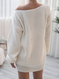 Back view of woman wearing white rib-knit mini sweater dress with off-shoulder design in a bright room