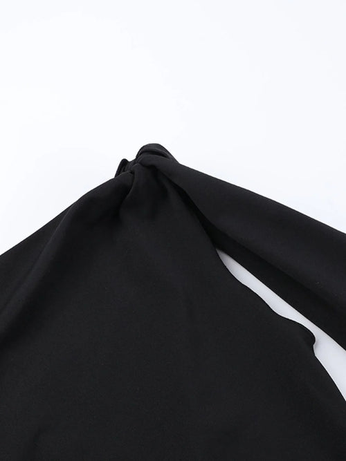 Black asymmetrical tied sleeveless maxi dress made of 100% polyester with no stretch and machine washable fabric.