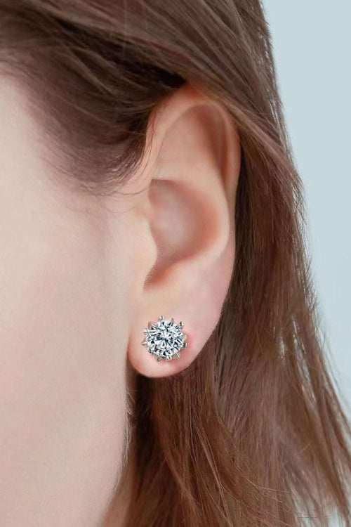 Close-up of ear wearing a Stuck On You 4 Carat Moissanite stud earring in minimalist sterling silver setting