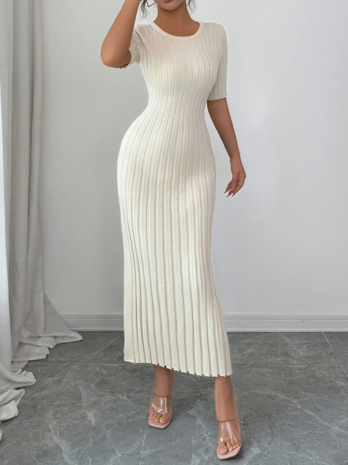 White ribbed round neck short sleeve sweater dress with moderate stretch, made of 100% viscose, styled in a fitted silhouette.