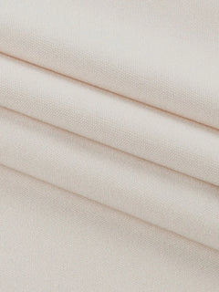 Close-up of beige polyester fabric for asymmetrical tied sleeveless maxi dress