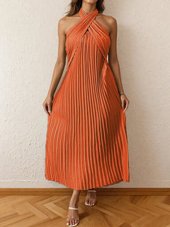 Orange pleated halter neck midi dress with a tied neckline and no stretch, made of 100% polyester.