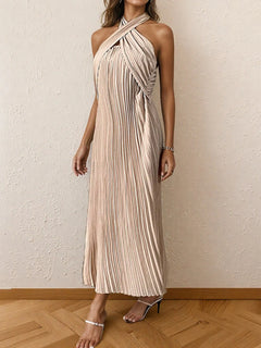 Beige pleated halter neck midi dress with tied detail and no stretch, made of 100% polyester.