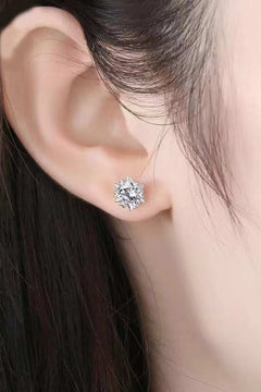 Close-up of an ear wearing a minimalist Stuck On You 4 Carat Moissanite stud earring in polished 925 sterling silver and platinum plating.