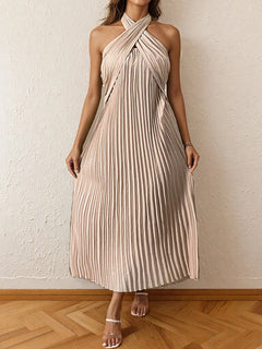 Beige pleated halter neck midi dress with tied neckline and no stretch, made of 100% polyester.