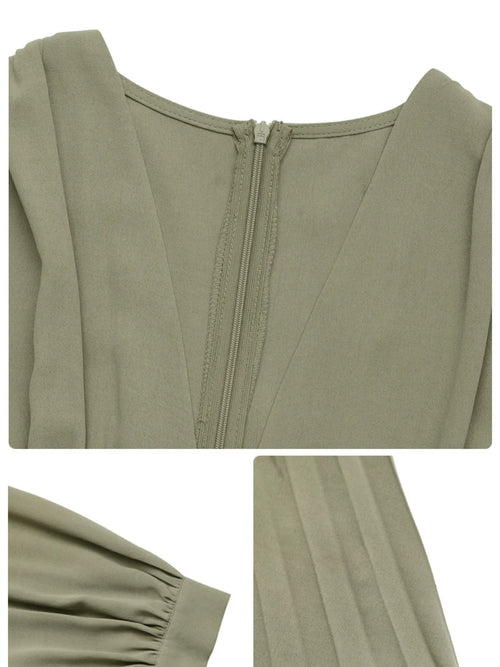 Close-up of olive pleated long sleeve V-neck dress with zipper and cuff details
