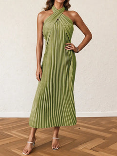 Green pleated halter neck midi dress with tied neckline and sleeveless design