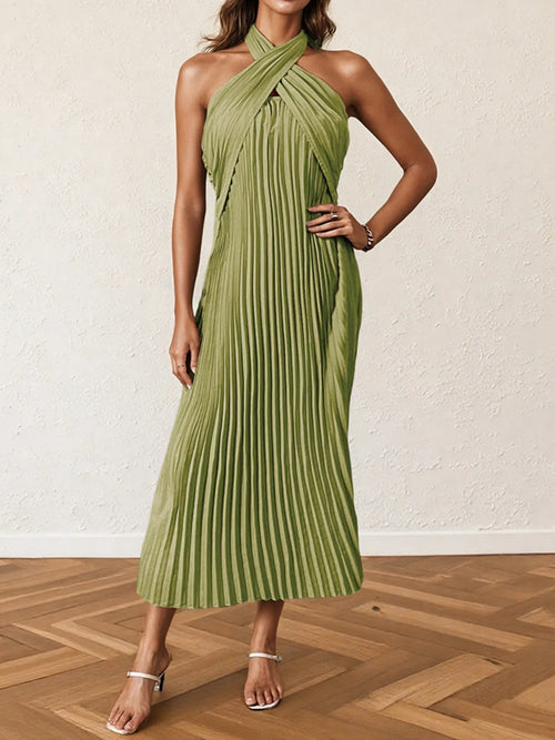 Green pleated halter neck midi dress with tied neckline and sleeveless design