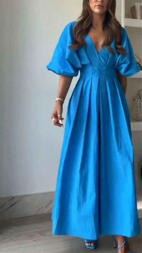 Blue V-neck half sleeve midi dress with ruched design and backless detail, made of 100% polyester.