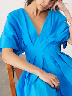 Blue V-neck half sleeve midi dress with ruched detailing and backless design