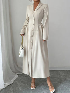 Elegant beige button-front long sleeve dress with ruching and no stretch, made of polyester and elastane.