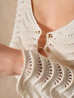Wave Openwork Crochet Maxi Knit Dress with cutout design and button details.