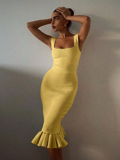 Woman wearing yellow ribbed knit bodycon dress with ruffle hem