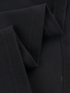 Close-up of black fabric detailing on asymmetrical tied sleeveless maxi dress made of 100% polyester