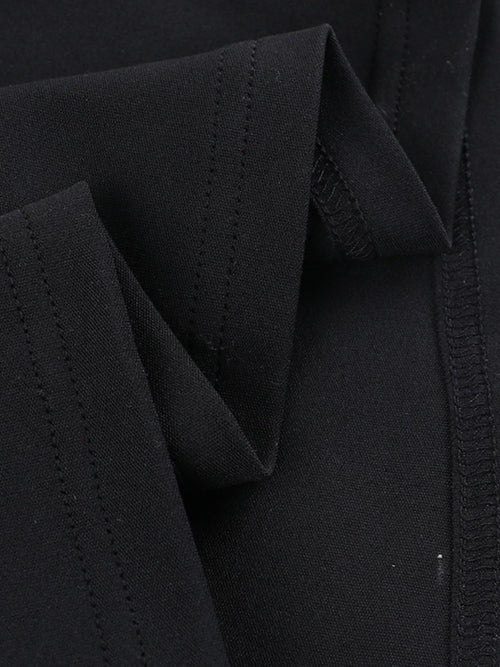 Close-up of black fabric detailing on asymmetrical tied sleeveless maxi dress made of 100% polyester