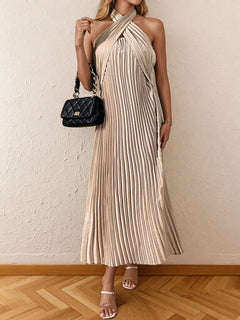 Beige pleated halter neck midi dress with tied neckline and no stretch fabric.