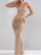 Nude rhinestone spaghetti strap maxi dress with slight stretch and fitted silhouette