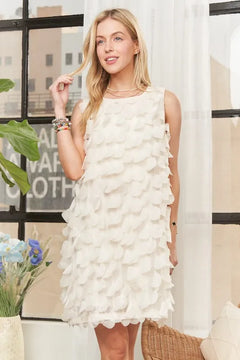 Sleeveless shift dress with 3D petal embellishments, perfect for special occasions.