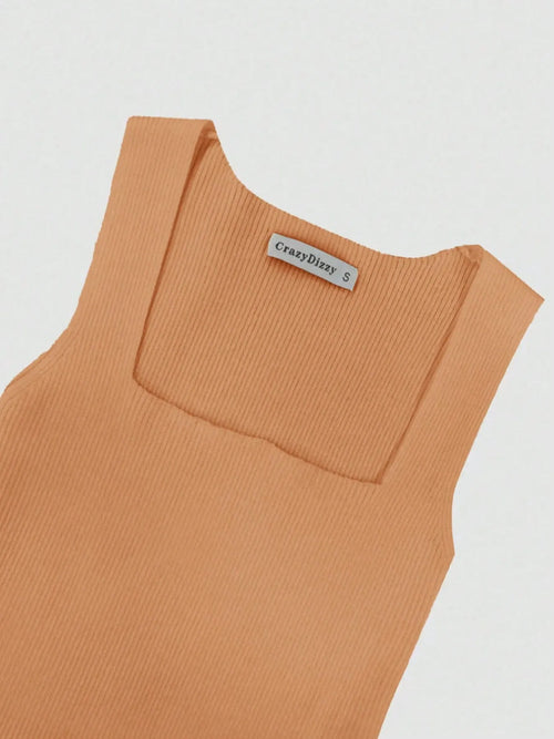 Close-up of ribbed knit bodycon dress in light brown with square neckline and sleeveless design