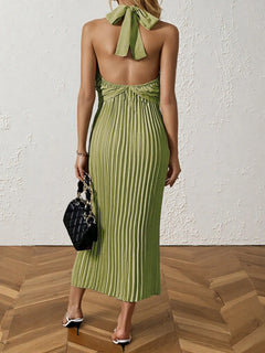 Green pleated halter neck midi dress with tied back and no stretch, made of 100% polyester.