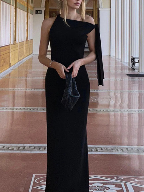 Black asymmetrical tied sleeveless maxi dress with a fitted silhouette and elegant design.
