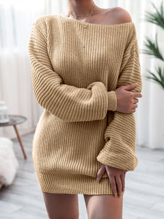 Beige rib-knit mini sweater dress with slightly stretchy fabric and long sleeves, featuring a relaxed fit and off-shoulder neckline, made of 100% acrylic.