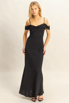 Woman wearing black HYFVE Flattering Fit Cami Maxi Dress with off-shoulder ruffled neckline and slim silhouette