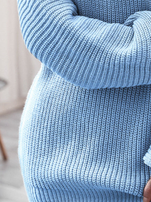 Close-up of light blue rib-knit mini sweater dress made of 100% acrylic with slightly stretchy fabric and basic style