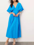 Blue V-neck half sleeve midi dress with ruched detailing and backless design made of 100% polyester.